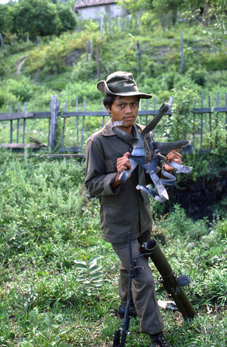 Honduran soldier with exploded mortar shell, Nicaragua, 1983