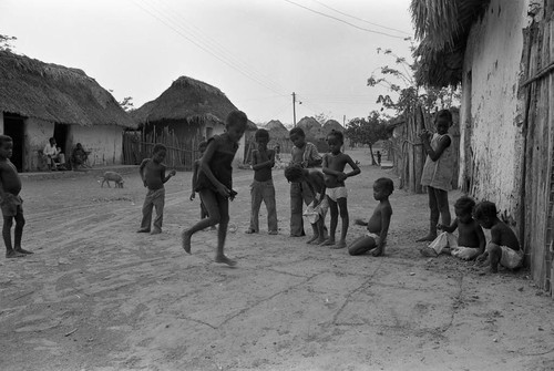 Children playing hopscotch on the street, San Basilio de Palenque, 1977