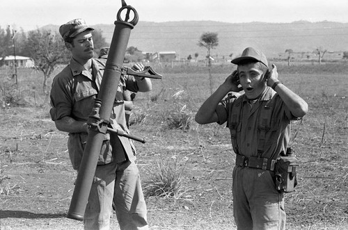 U.S. advisor training Salvadoran soldiers at military base, Ilopango, 1983