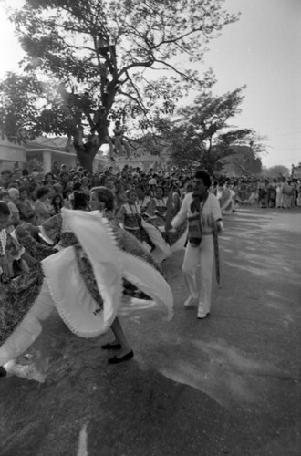 Dancers performing in the street, Barranquilla, Colombia, 1977