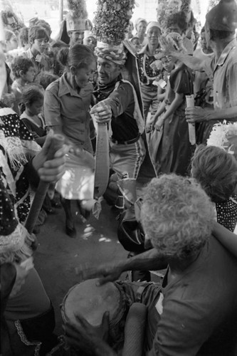 Dancers walking among the Carnival crowd, Barranquilla, Colombia, 1977