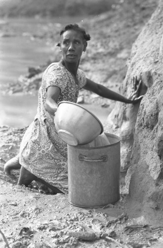 Woman collecting water, San Basilio de Palenque, Colombia, 1977