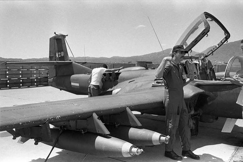 U.S. advisor speaking beside a plane, Ilopango, San Salvador, 1983