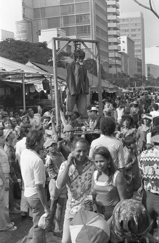 Young boy performing from a gallows, Barranquilla, Colombia, 1977