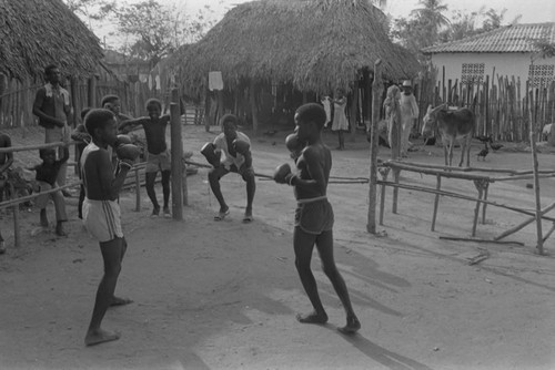 Boxers fighting inside ring, San Basilio de Palenque, ca. 1978