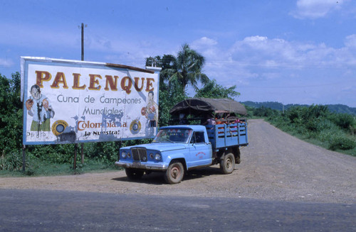 Truck and billboard welcoming people to Palenque, San Basilio de Palenque, 1976