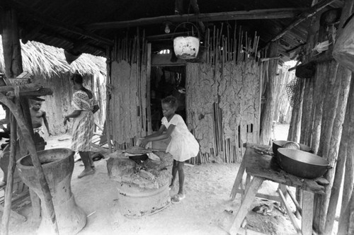 Young girl near wood stove, San Basilio de Palenque, Colombia, 1977