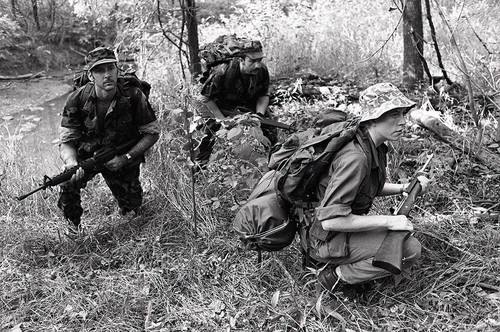 Survival school students participate in an obstacle course training, Liberal, 1982