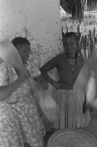 Woman grinding corn, San Basilio de Palenque, ca. 1978