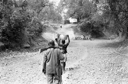 Women head-carrying water buckets, San Basilio de Palenque, 1977