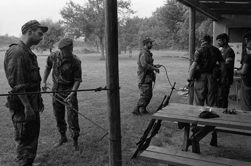 Survival school students tie rope, Liberal, 1982