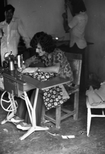 Man operating a sewing machine, La Chamba, Colombia, 1975