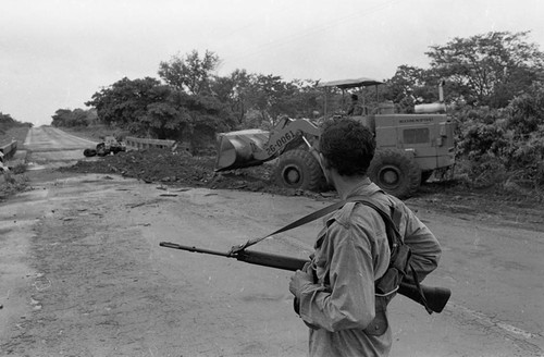 Sandinista stands near a bridge, Nicaragua, 1979