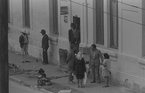 A group of men and women socializing, Bogotá, Colombia, 1976