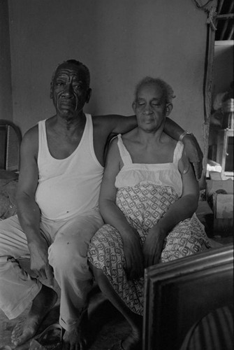 Couple sitting on bed, San Basilio de Palenque, 1976