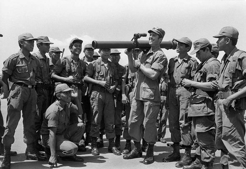 U.S. military advisor training Salvadoran soldiers how to use mortars, Ilopango, 1983