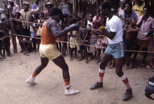 Boxers fighting inside boxing ring, San Basilio de Palenque, 1976