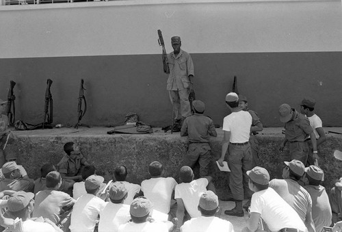 U.S. advisor training Salvadoran soldiers at military base, Ilopango, 1983