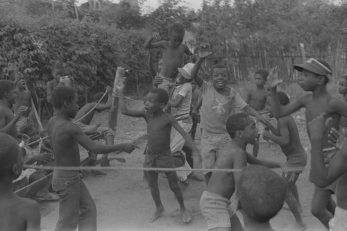 Children cheering inside boxing ring, San Basilio de Palenque, ca. 1978