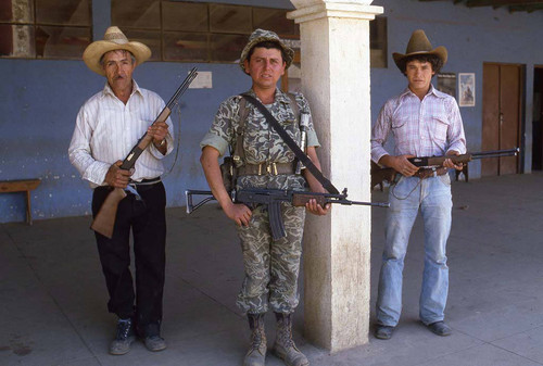 An armed soldier and two members of the civil defense, Zaragoza, 1984