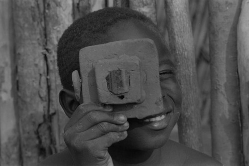 Boy playing with a toy camera, San Basilio de Palenque, 1977