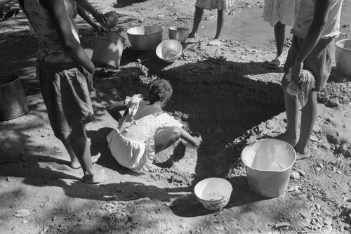 Girl collecting water at river, San Basilio de Palenque, ca. 1978