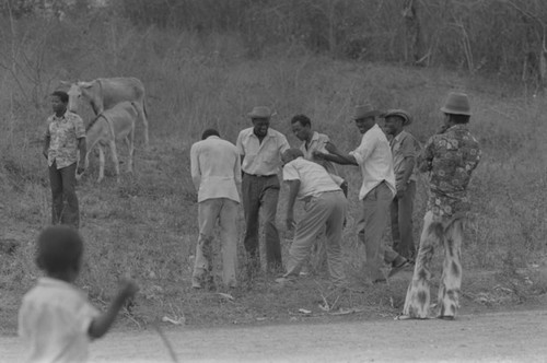 Men in conversation near cemetery, San Basilio de Palenque, Colombia, 1977