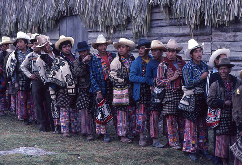 Mayan men wait in line to vote, Guatemala, 1982