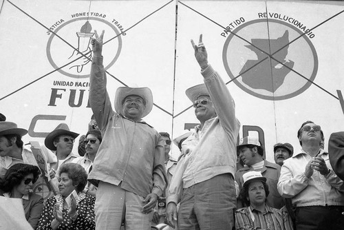 Presidential candidate Ángel Aníbal Guevara and his running mate Ramiro Ponce hold up the "V" sign, Guatemala City, 1982