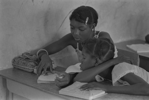 Students in a classroom reading a book, San Basilio de Palenque, ca. 1978