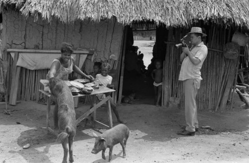 A photographer records villagers, San Basilio de Palenque, 1977