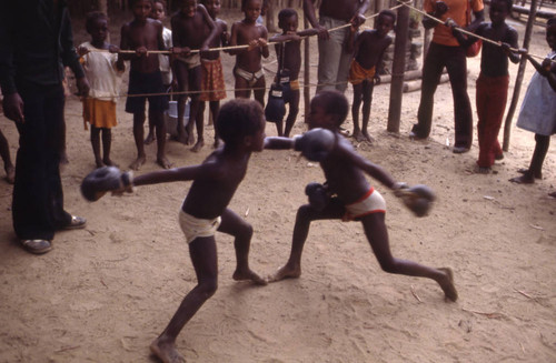 Children boxing inside ring, San Basilio de Palenque, 1976