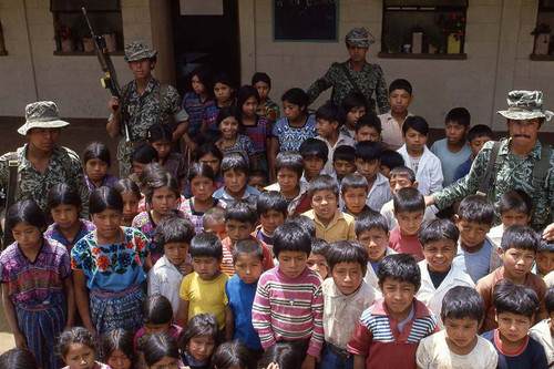 School children stand surrounded by four soldiers, Zaragoza, 1982