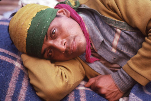 Guatemalan refugee laying on the ground, Santiago el Vértice, 1983