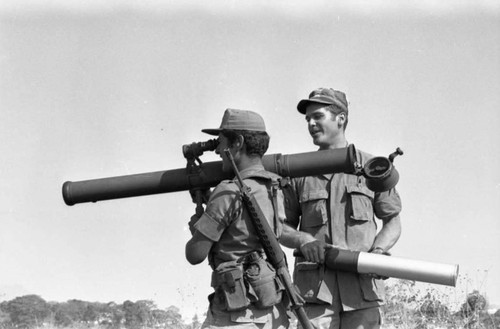 A U.S. military advisor training a Salvadoran soldier at Ilopango Military Base, Ilopango, 1983