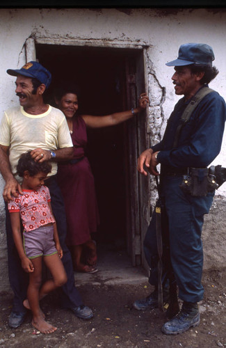 Contra soldier with people, Honduras, 1983