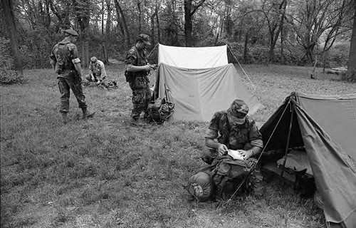 Survival school students near tents, Liberal, 1982