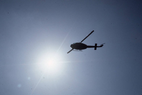 Helicopter flying over San Salvador during papal visit, El Salvador, 1983