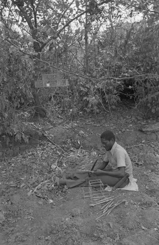 Young man building an animal trap, San Basilio de Palenque, 1977