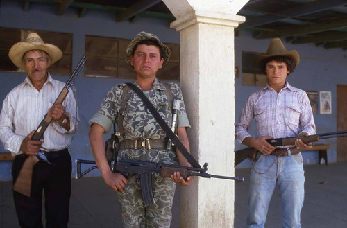 An armed soldier and two members of the civil defense, Zaragoza, 1982