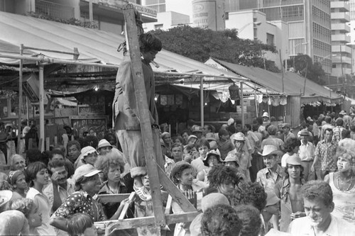 Young boy performing from a gallows, Barranquilla, Colombia, 1977