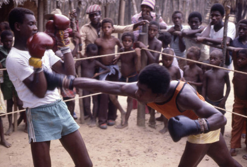 Boxers fighting inside boxing ring, San Basilio de Palenque, 1976