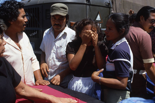 A young woman cries during a funeral procession, Nicaragua, 1983