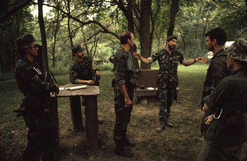 Survival school students await instructions, Liberal, 1982