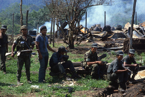 Contras rest among the rubble, Nicaragua, 1983