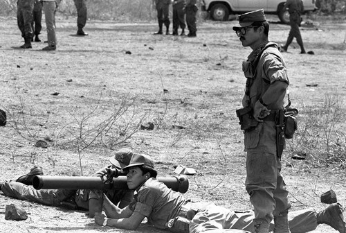 U.S. advisor training Salvadoran soldiers at military base, Ilopango, 1983