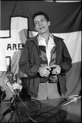 Roberto D'Aubuisson speaks with a cigarette in hand, San Salvador, 1982