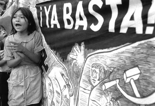 Little girl proclaims "¡ya basta!," San Salvador, 1982