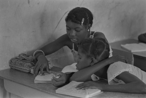 Students in a classroom reading a book, San Basilio de Palenque, ca. 1978