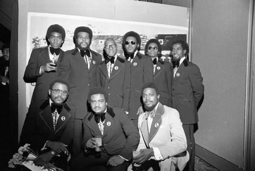 Men posing at formal event